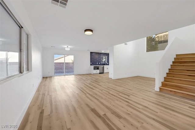 unfurnished living room featuring light hardwood / wood-style flooring