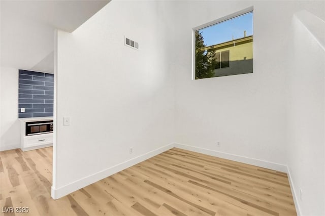 spare room featuring light hardwood / wood-style floors