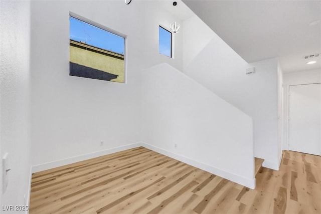 bonus room featuring light wood-type flooring