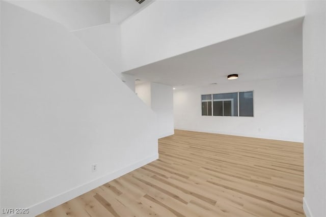 spare room featuring light hardwood / wood-style flooring