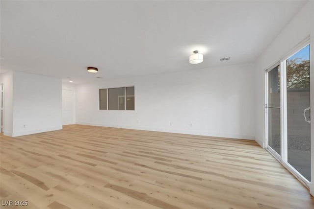 spare room with light wood-type flooring