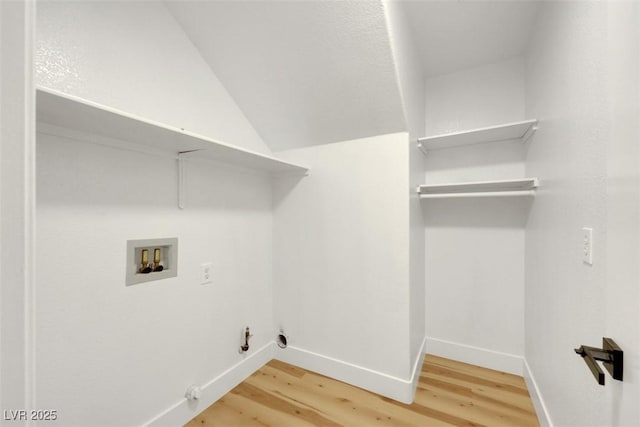 washroom with gas dryer hookup, washer hookup, and wood-type flooring