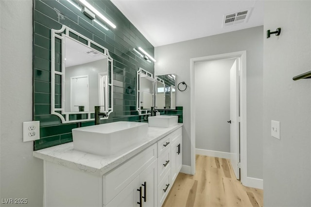 bathroom featuring vanity and hardwood / wood-style floors