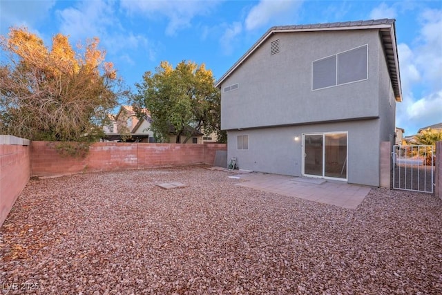 back of property featuring a patio area