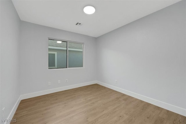 unfurnished room featuring light hardwood / wood-style flooring