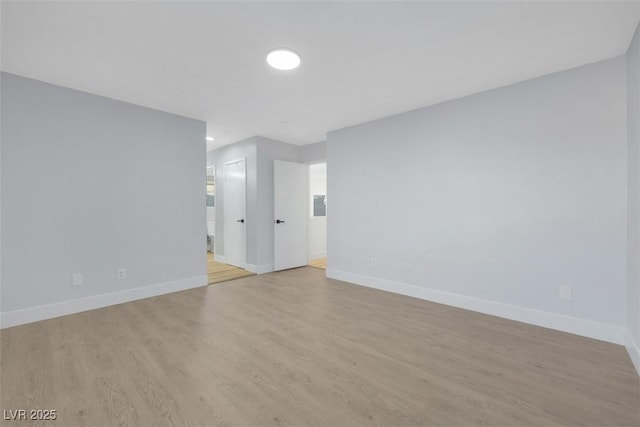 unfurnished room with light hardwood / wood-style flooring