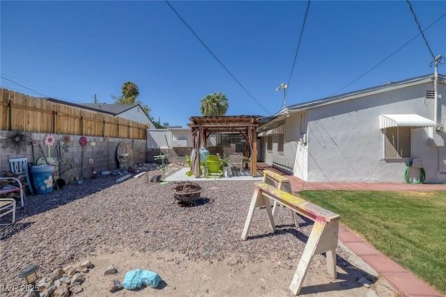 view of yard featuring an outdoor fire pit and a pergola