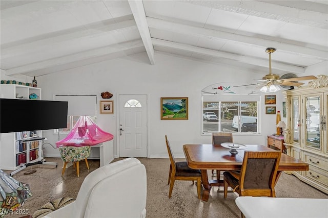 dining room with ceiling fan and vaulted ceiling with beams