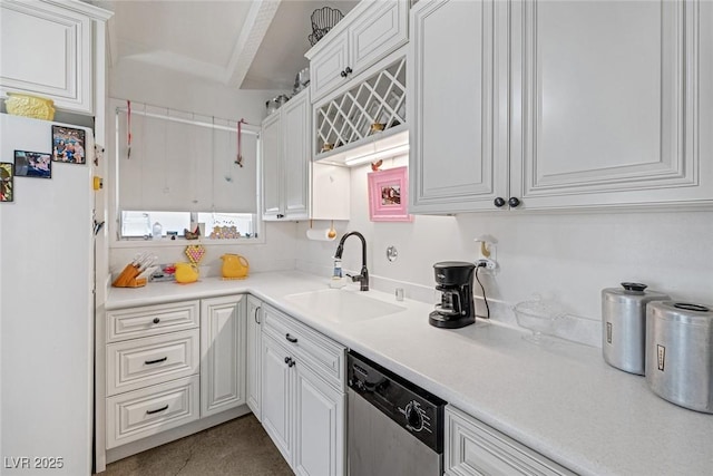 kitchen featuring sink, white cabinets, dishwasher, and white refrigerator