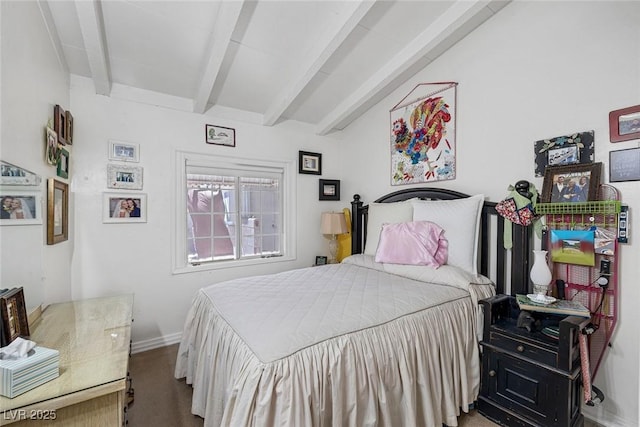 bedroom featuring vaulted ceiling with beams