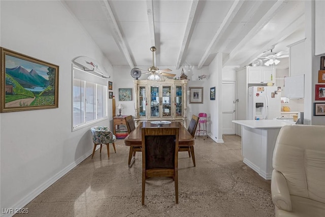 dining room with beam ceiling and ceiling fan