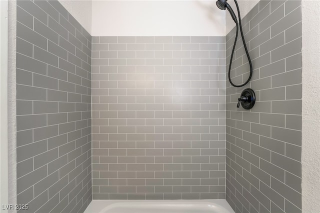 full bathroom with a tile shower