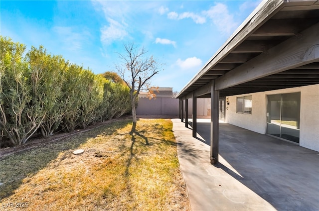 view of yard featuring a patio area and fence