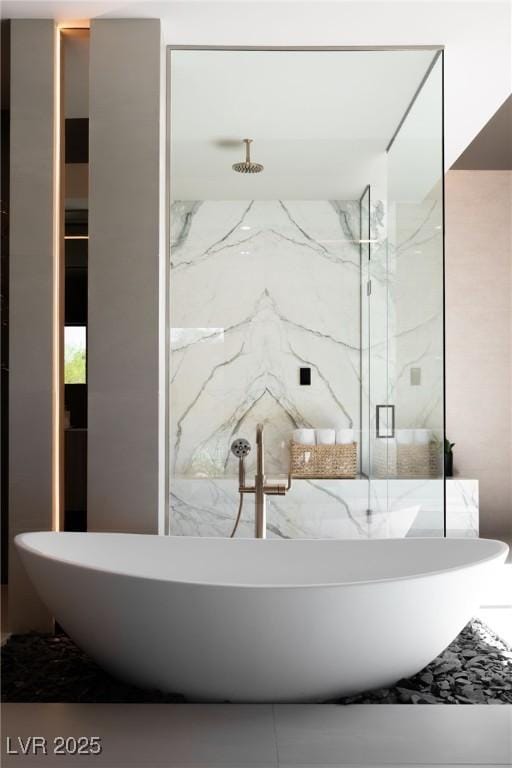 bathroom featuring sink and shower with separate bathtub