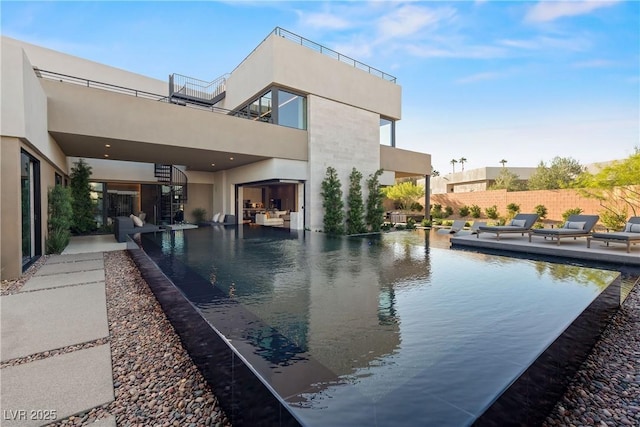 view of swimming pool with a patio area