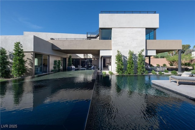 view of pool featuring a water view