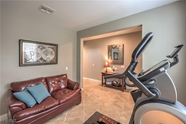 workout area featuring light tile patterned flooring