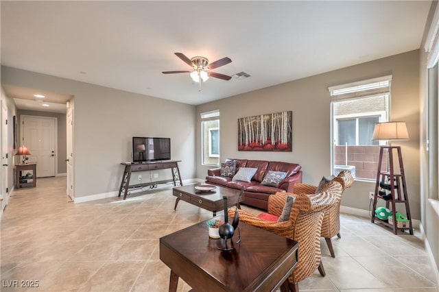 living room featuring light tile patterned floors and ceiling fan