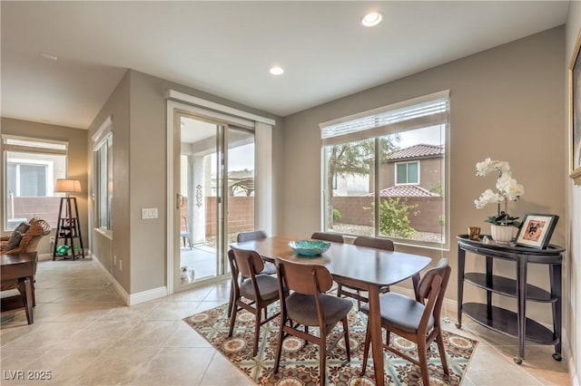 dining area featuring light tile patterned flooring