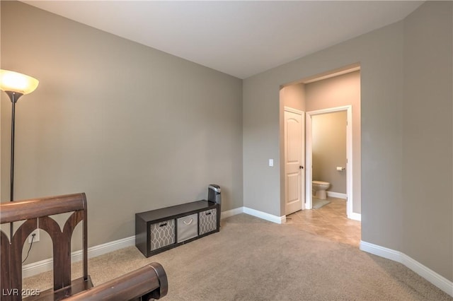 living area with light colored carpet