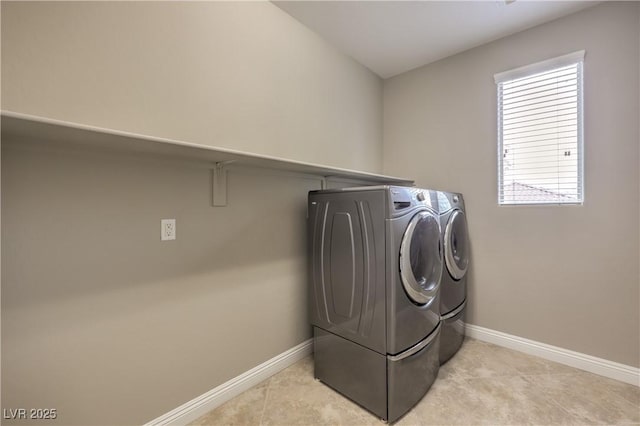 washroom featuring separate washer and dryer and light tile patterned floors