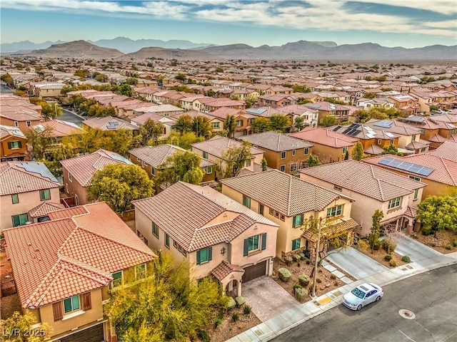 birds eye view of property with a mountain view