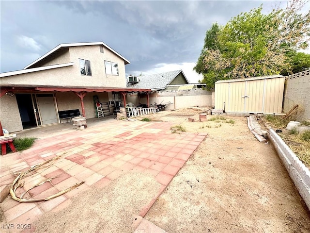 3620 Park Oliver Dr, Las Vegas, NV 89110 - back of house with a patio, a fenced backyard, and stucco siding