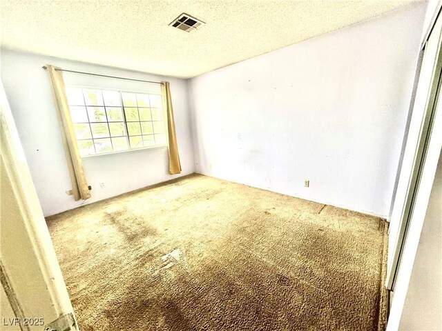 3620 Park Oliver Dr, Las Vegas, NV 89110 - empty room featuring carpet and a textured ceiling