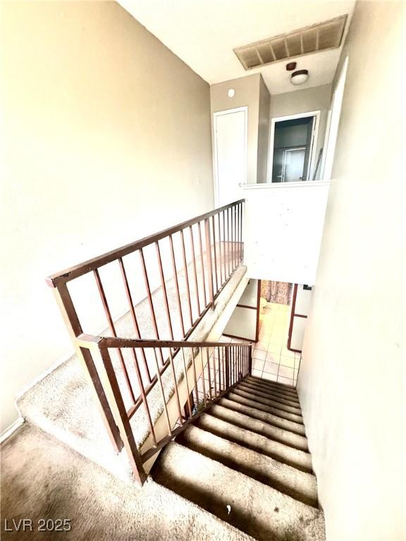 3620 Park Oliver Dr, Las Vegas, NV 89110 - stairway featuring carpet flooring