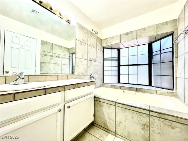 bathroom with vanity, tile walls, and tile patterned floors