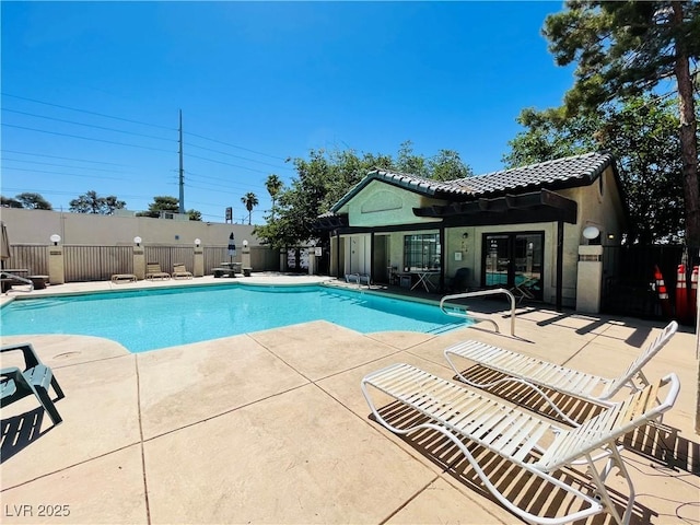 view of swimming pool with a patio area