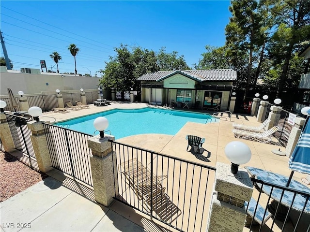 view of swimming pool featuring a patio area