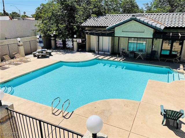 view of pool featuring a patio