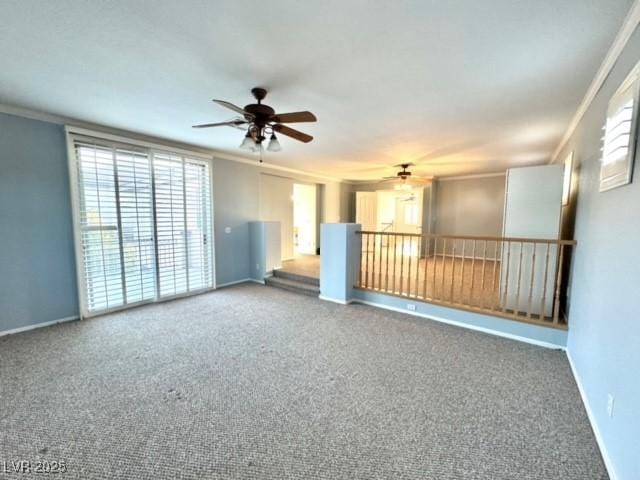 unfurnished room with ceiling fan, ornamental molding, and carpet