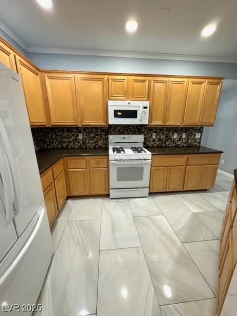 kitchen featuring tasteful backsplash, white appliances, and ornamental molding