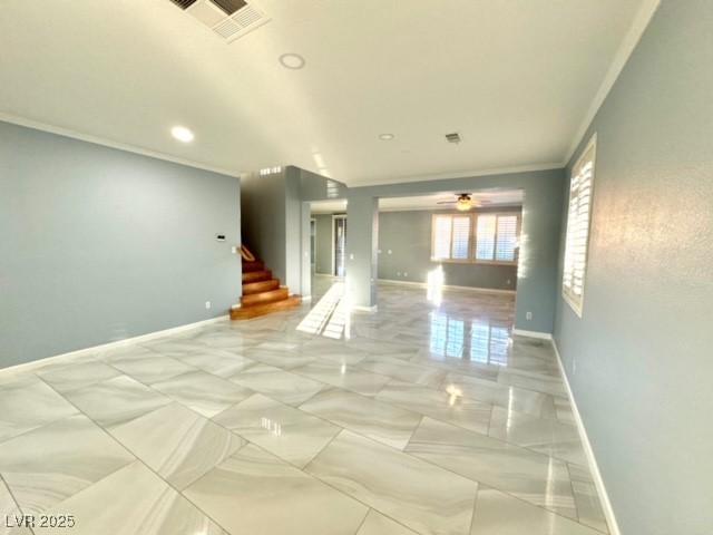 unfurnished room featuring crown molding and ceiling fan