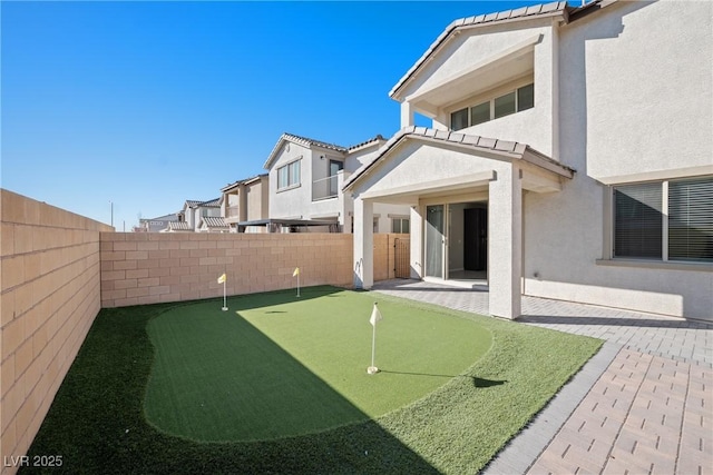 view of yard with a patio and a fenced backyard