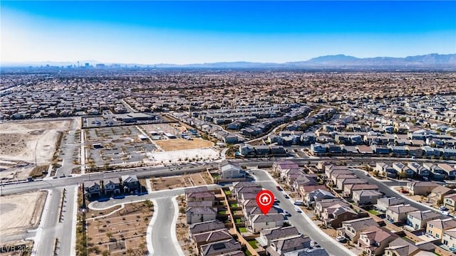 drone / aerial view featuring a residential view and a mountain view