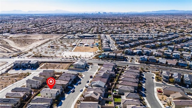 birds eye view of property with a residential view and a mountain view