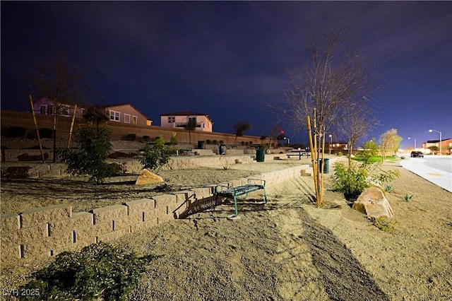 yard at night with fence