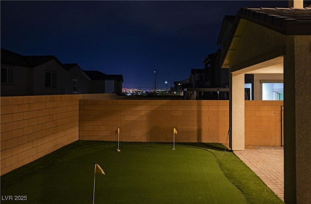 yard at twilight with fence