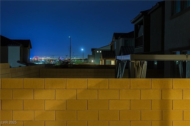 yard at night with fence