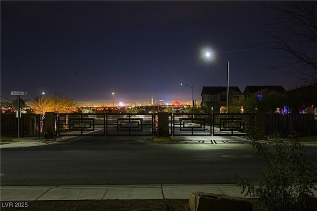 view of property's community featuring a gate and fence