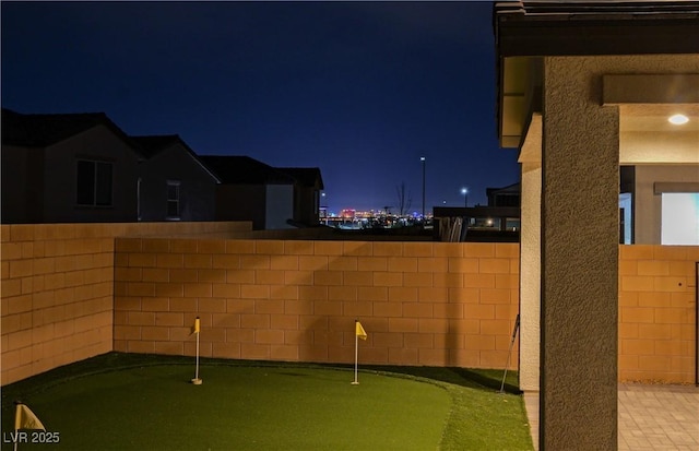 yard at night with fence