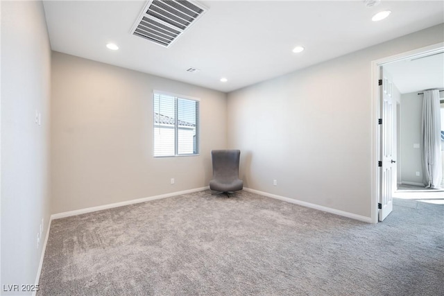 unfurnished room featuring baseboards, visible vents, carpet flooring, and recessed lighting