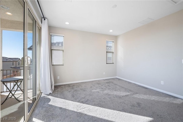 carpeted spare room with recessed lighting and baseboards