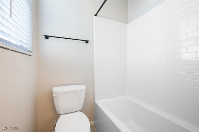 full bathroom featuring tub / shower combination and toilet