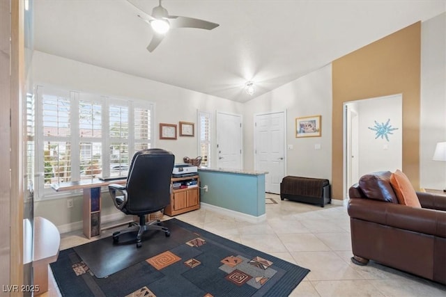 office area featuring light tile patterned flooring, ceiling fan, and vaulted ceiling