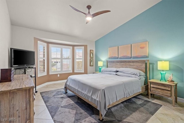 tiled bedroom featuring vaulted ceiling and ceiling fan