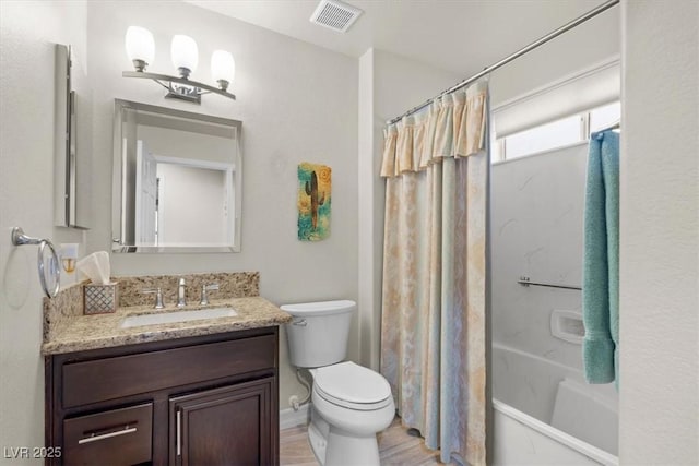 full bathroom featuring shower / bath combo, wood-type flooring, vanity, and toilet